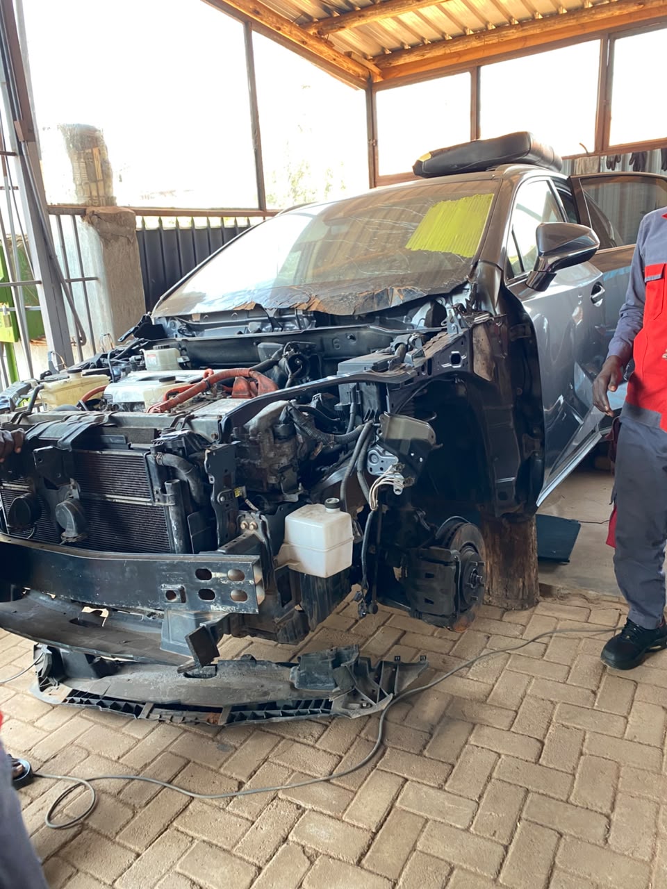 RESTORING BURNT HYBRID LEXUS RX450h - Auto Messiah Workshop Mechanics in Kampala